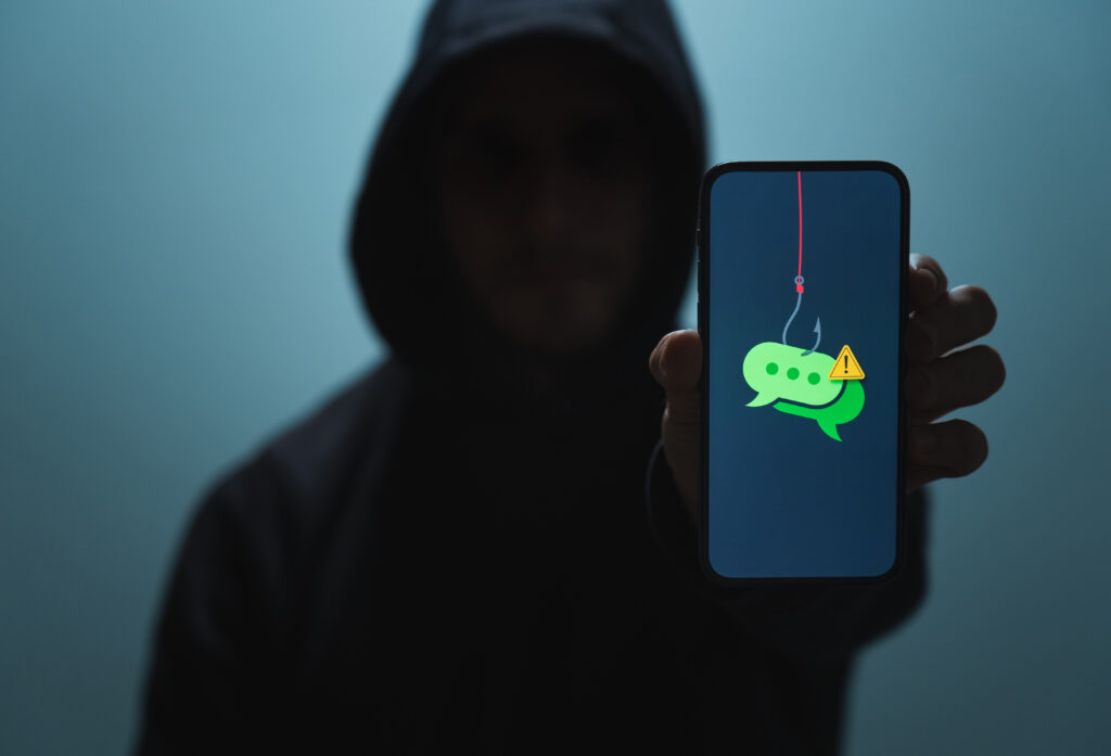 social engineering hacker with phishing message on iphone